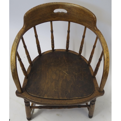 26 - AN OAK ARMCHAIR