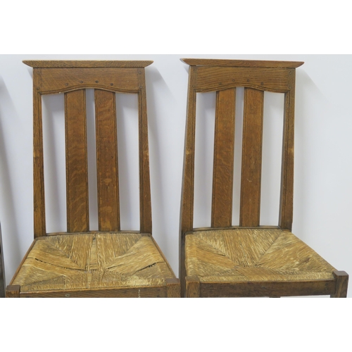 34 - A SET OF SIX ARTS AND CRAFTS DINING CHAIRS WITH RUSH SEATS