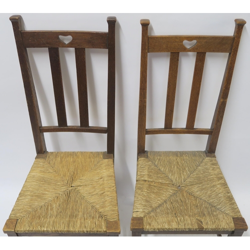 34 - A SET OF SIX ARTS AND CRAFTS DINING CHAIRS WITH RUSH SEATS