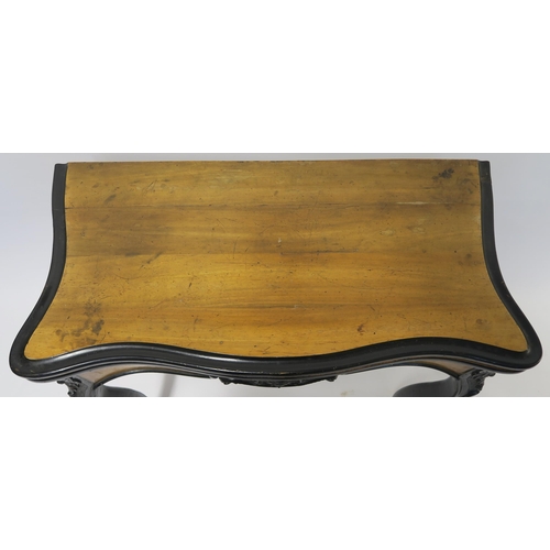 4 - A CONTINENTAL WALNUT AND EBONISED FOLD OVER CARD TABLE