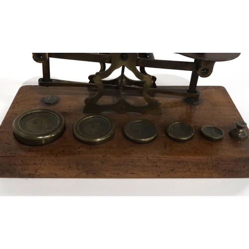 75 - A PAIR OF BRASS POSTAL SCALES