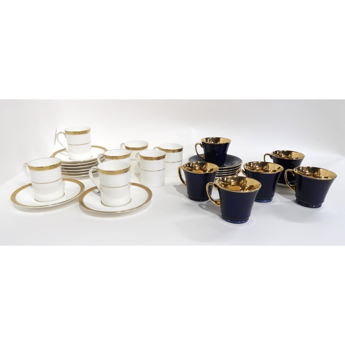 87 - SIX CROWN DEVON DARK BLUE AND GILT COFFEE CUPS AND SAUCERS