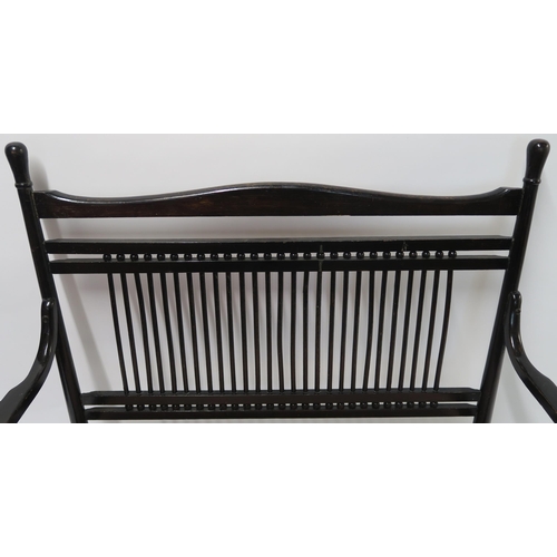 9 - A BENTWOOD EBONISED SPARBACK SETTEE