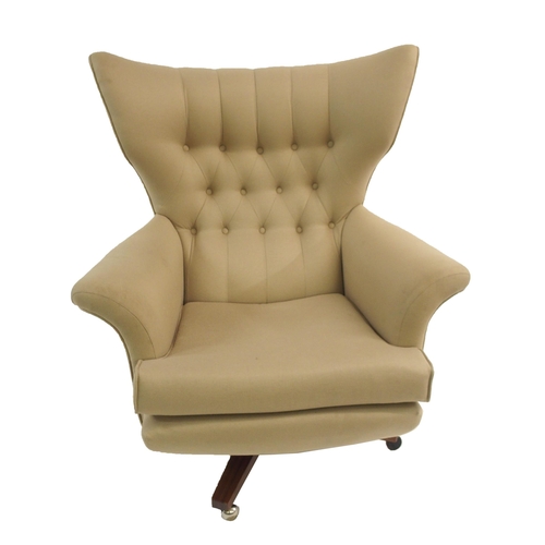 1137 - A G-PLAN BUTTON BACK SWIVEL ARMCHAIR