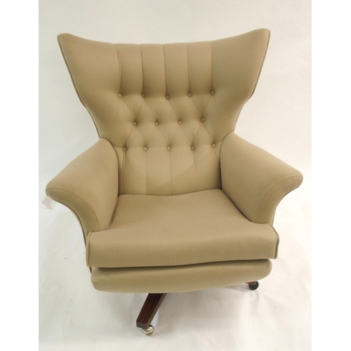 1137 - A G-PLAN BUTTON BACK SWIVEL ARMCHAIR