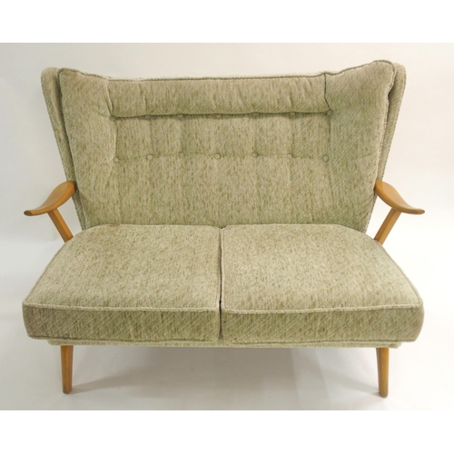 1148 - A HOWARD KEITH FOR HK FURNITURE MID-CENTURY GREEN UPHOLSTERED TWO SEATER SETTEE