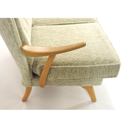 1148 - A HOWARD KEITH FOR HK FURNITURE MID-CENTURY GREEN UPHOLSTERED TWO SEATER SETTEE