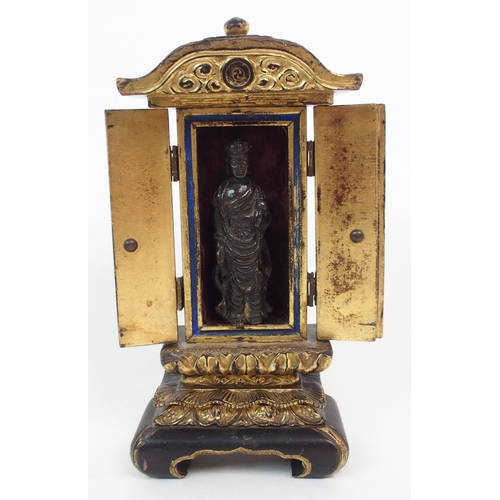 140 - A BLACK AND GILT LACQUERED TABLE SHRINE