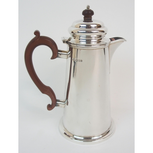 153 - A SILVER HOT MILK JUG