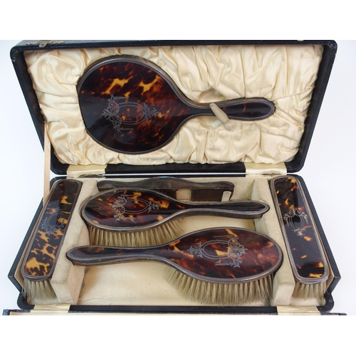 174 - A SIX-PIECE SILVER AND TORTOISESHELL DRESSING TABLE SET