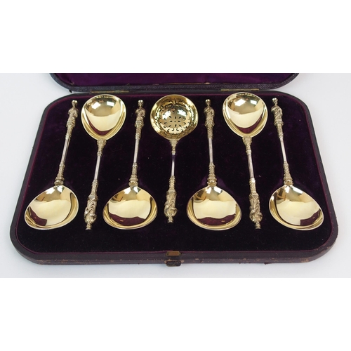 179 - A CASED SET OF SIX VICTORIAN SILVER GILT APOSTLE SERVING SPOONS WITH A STRAINING SPOON