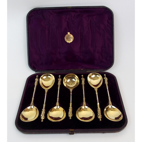 179 - A CASED SET OF SIX VICTORIAN SILVER GILT APOSTLE SERVING SPOONS WITH A STRAINING SPOON