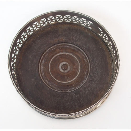 182 - AN 18TH CENTURY SILVER WINE COASTER