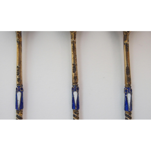 188 - A SET OF FIVE RUSSIAN SILVER GILT AND ENAMEL SPOONS