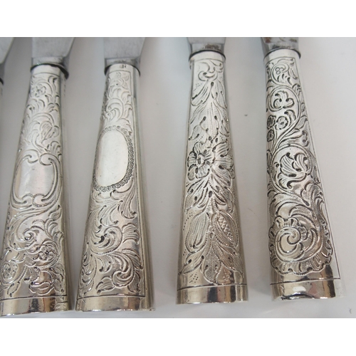 192 - A SET OF EIGHT VICTORIAN SILVER HANDLED STEEL BLADED DINNER KNIVES