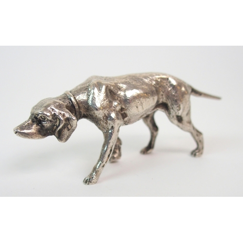 195 - A CONTINENTAL SILVER MODEL OF A DOG