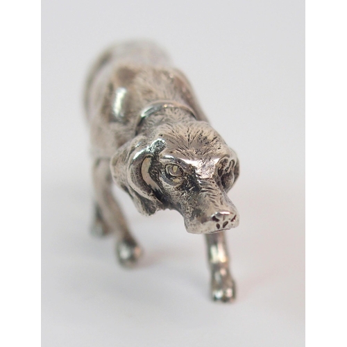 195 - A CONTINENTAL SILVER MODEL OF A DOG