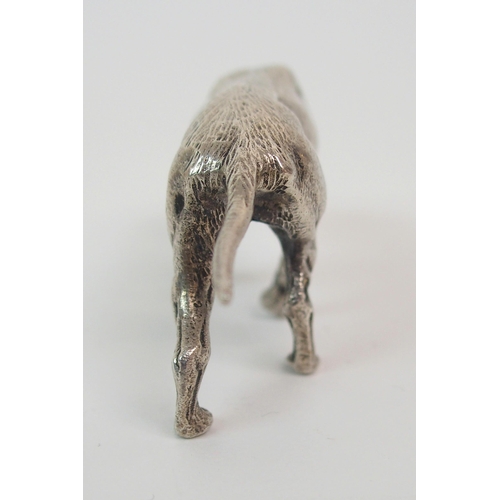 195 - A CONTINENTAL SILVER MODEL OF A DOG