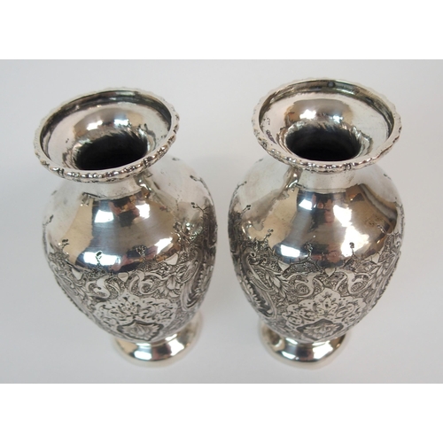 196 - A PAIR OF CONTINENTAL WHITE-METAL BALUSTER VASES