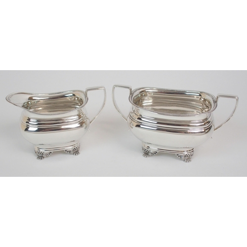 211 - A SILVER THREE-PIECE TEA SERVICE