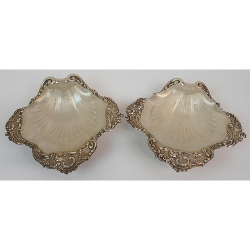 216 - A CASED PAIR OF SILVER BUTTER DISHES