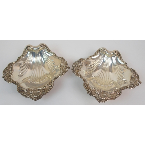 216 - A CASED PAIR OF SILVER BUTTER DISHES