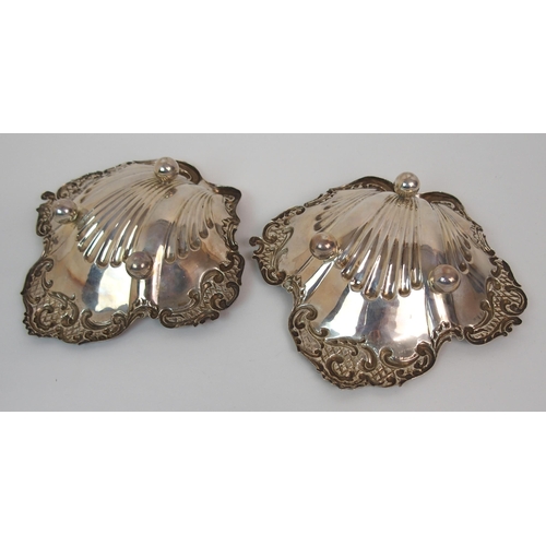 216 - A CASED PAIR OF SILVER BUTTER DISHES