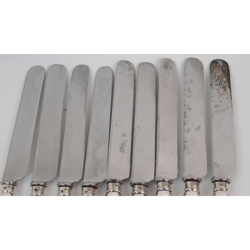 222 - A SET OF NINE RUSSIAN SILVER-HANDLED DINNER KNIVES