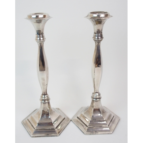 226 - A PAIR OF SILVER CANDLESTICKS