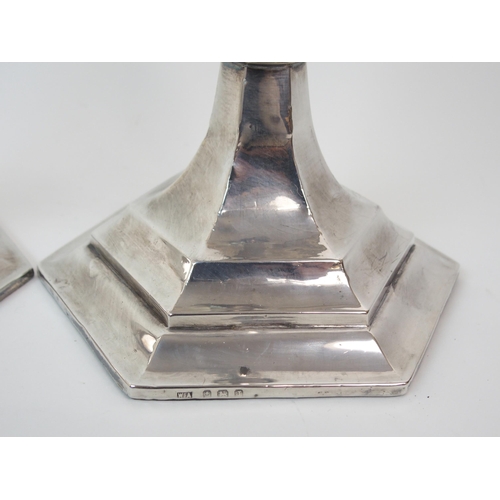 226 - A PAIR OF SILVER CANDLESTICKS