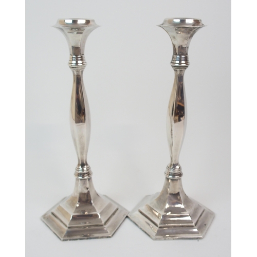 226 - A PAIR OF SILVER CANDLESTICKS