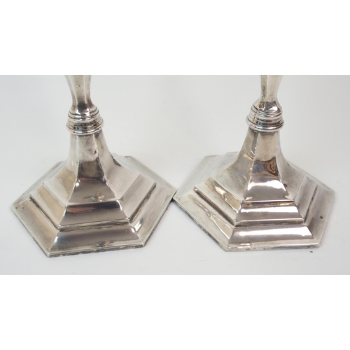 226 - A PAIR OF SILVER CANDLESTICKS