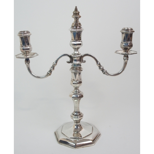 227 - A SILVER TWO-BRANCH CANDELABRUM