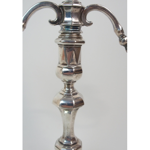 227 - A SILVER TWO-BRANCH CANDELABRUM