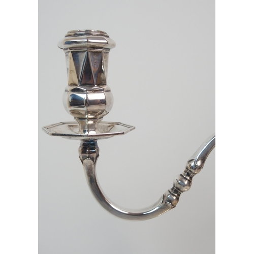 227 - A SILVER TWO-BRANCH CANDELABRUM