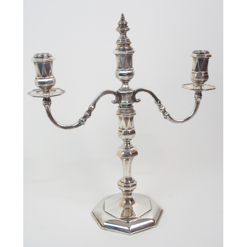 227 - A SILVER TWO-BRANCH CANDELABRUM