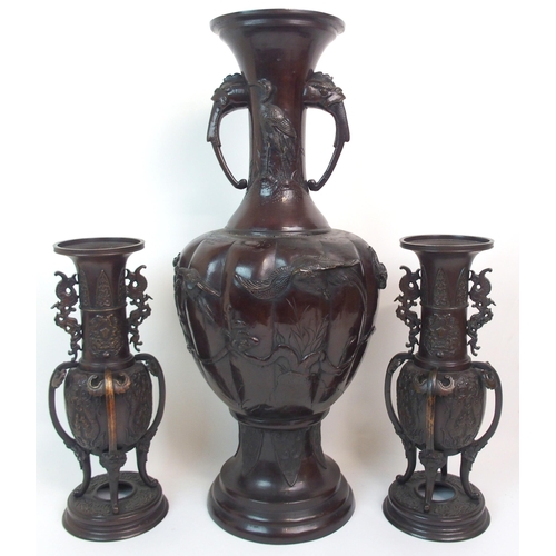 46 - A CHINESE BRONZE LOBED TWO-HANDLED VASE