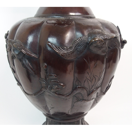 46 - A CHINESE BRONZE LOBED TWO-HANDLED VASE