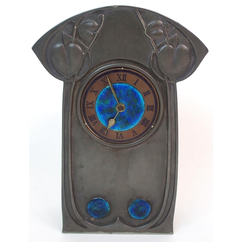 558 - AN ARCHIBALD KNOX PEWTER MANTLE CLOCK