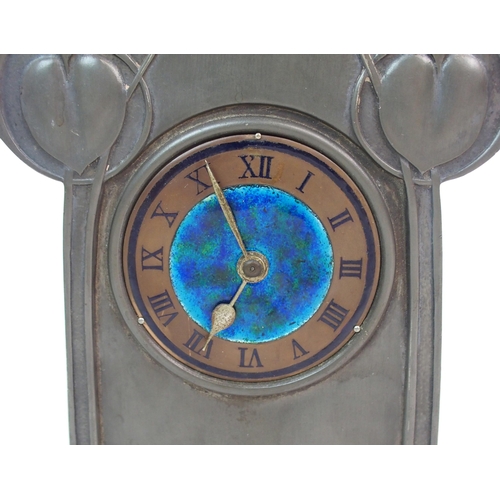 558 - AN ARCHIBALD KNOX PEWTER MANTLE CLOCK