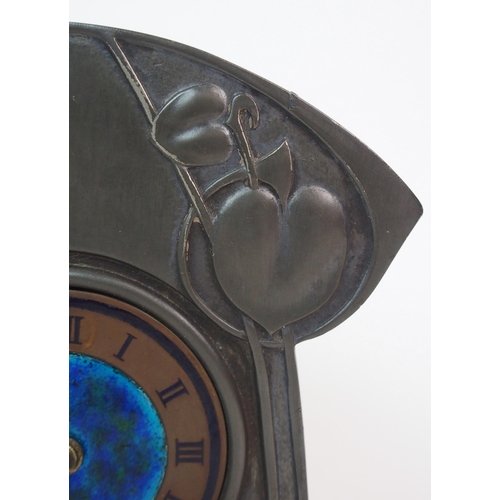 558 - AN ARCHIBALD KNOX PEWTER MANTLE CLOCK