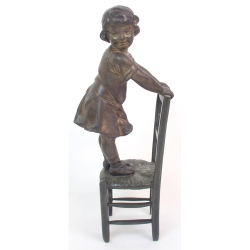 562 - A SPELTER FIGURE OF A GIRL