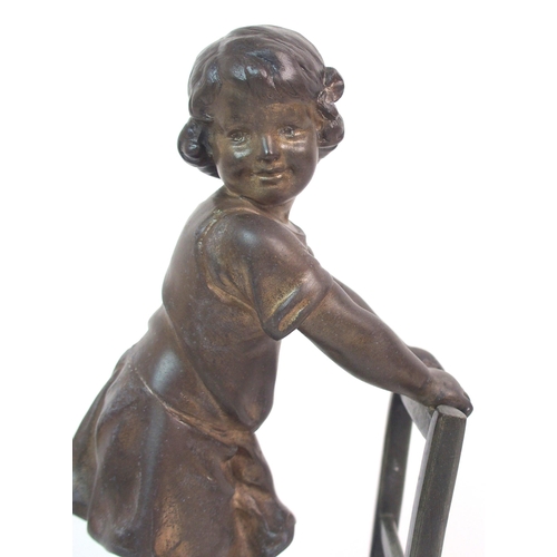 562 - A SPELTER FIGURE OF A GIRL