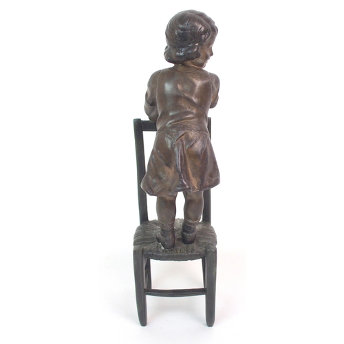 562 - A SPELTER FIGURE OF A GIRL