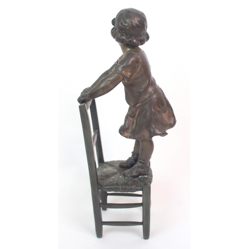 562 - A SPELTER FIGURE OF A GIRL