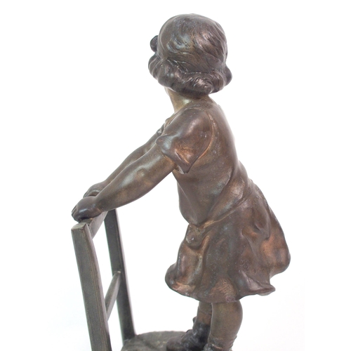 562 - A SPELTER FIGURE OF A GIRL