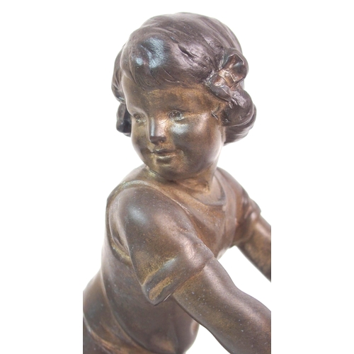 562 - A SPELTER FIGURE OF A GIRL