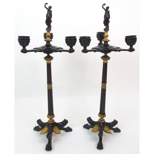 565 - A PAIR OF CAST BRONZE CANDELABRA