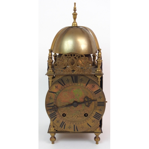 568 - A BRASS LANTERN CLOCK