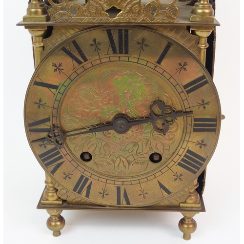 568 - A BRASS LANTERN CLOCK